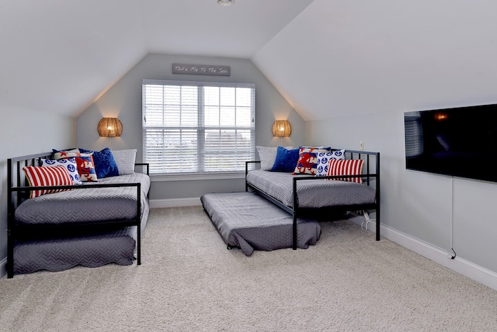 Bright, functional room with a trundle bed, offering flexible sleeping arrangements for families or groups.