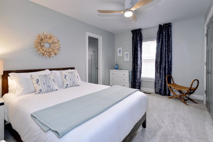 Bright, airy bedroom with a king/queen bed, offering a cozy spot to relax and recharge.