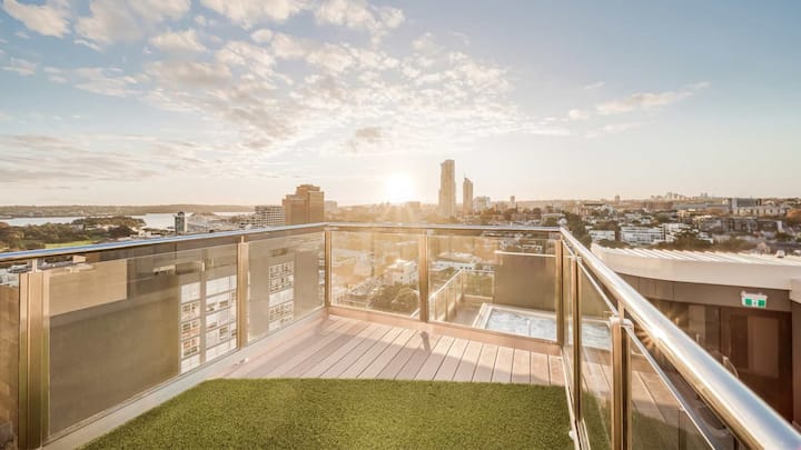 360 views from the rooftop looking out over the city and pool/spa.