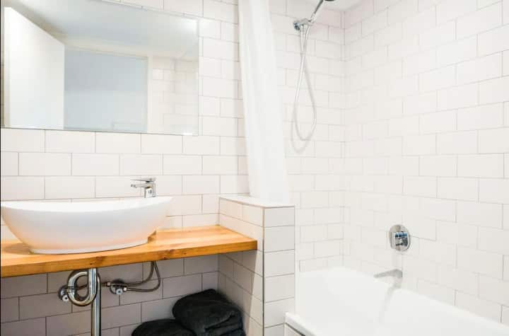 Bathroom with shower and bath to relax after a long day of exploring or work.