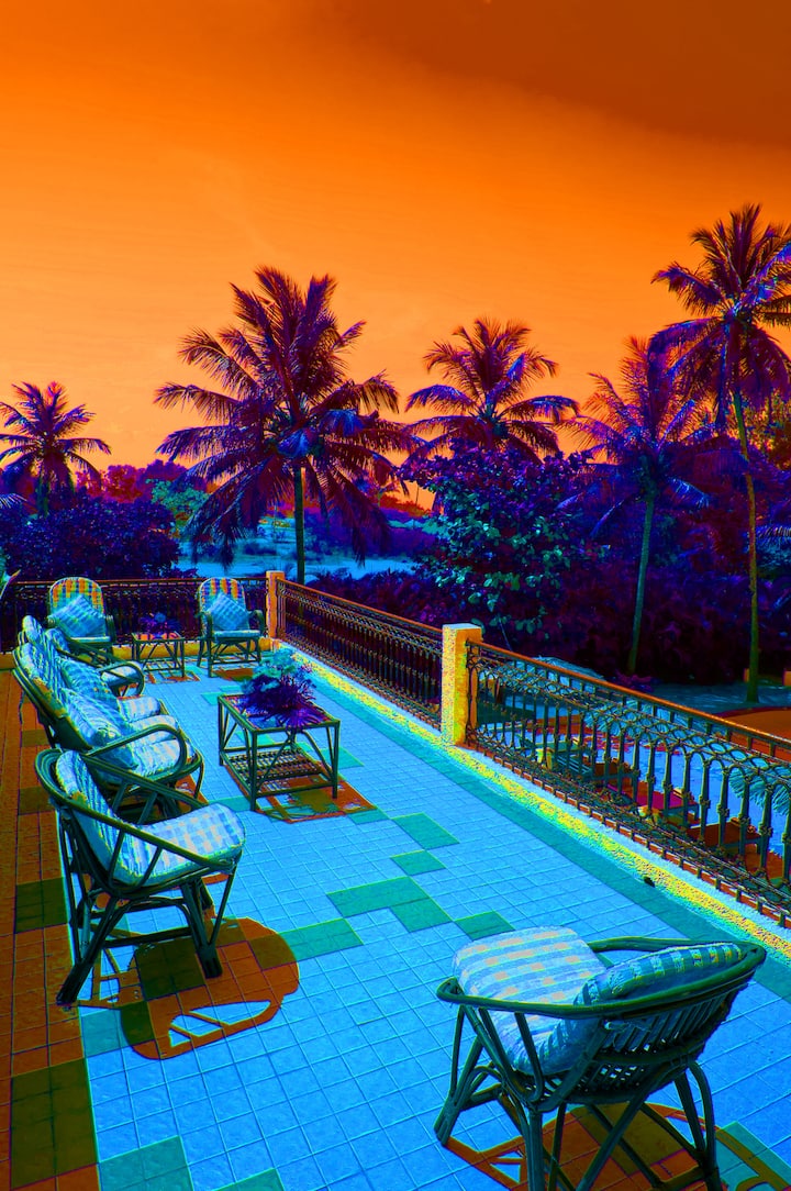 The sunset balcony accessed from a spiral staircase with views of the ocean.