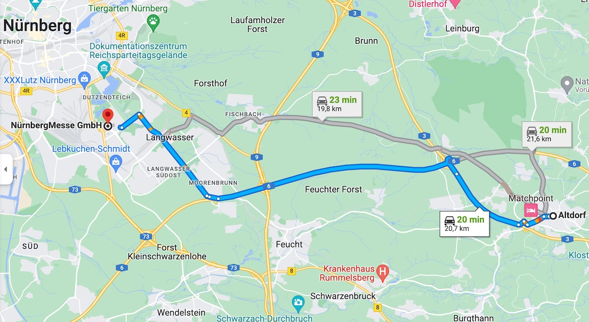 A map illustrates the route from NürnbergMesse GmbH to Altdorf, highlighting the distances and estimated travel times. The main roads and surrounding areas are marked, showing connection points such as Langwasser and Matchpoint, along with local landmarks.