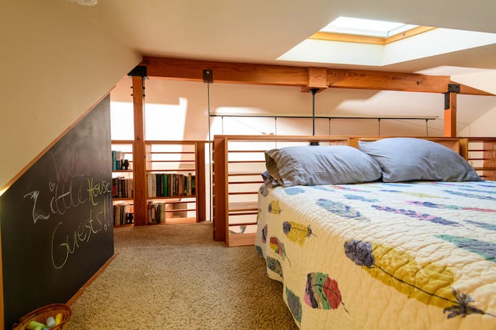 Comfortable queen bed with skylight.  Bookcase is a little free library.  Take a book or leave a book.