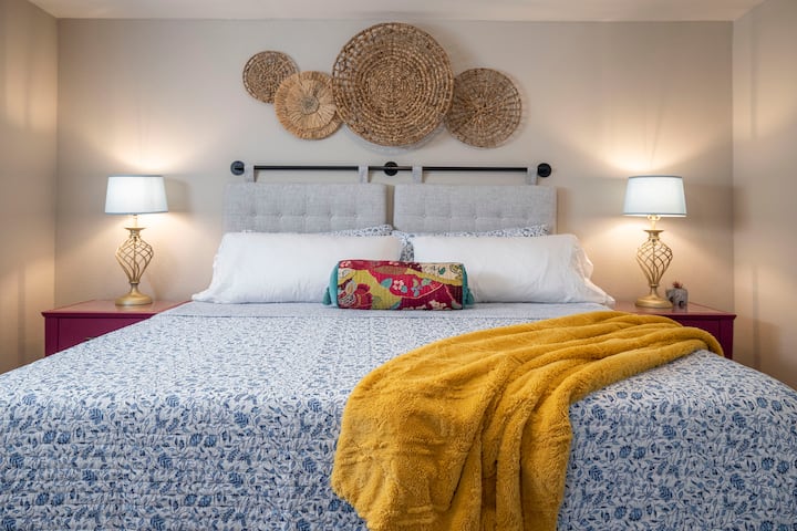 Bedroom 2:  King Size Bed:  This bedroom has a boho vibe with purple accents.  