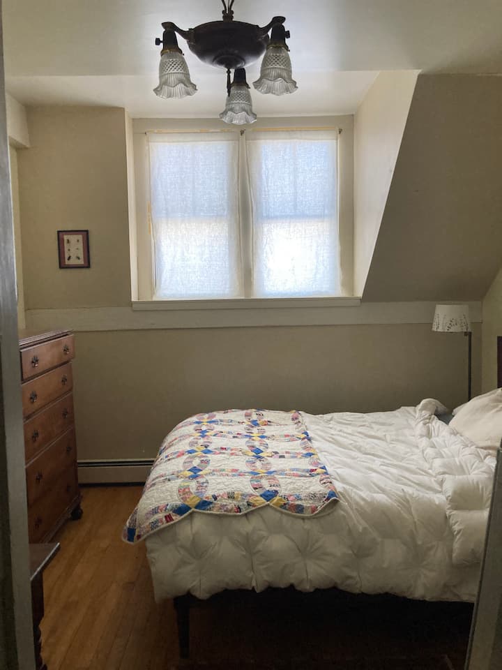 East wing bedroom 1 - dresser and desk with queen bed