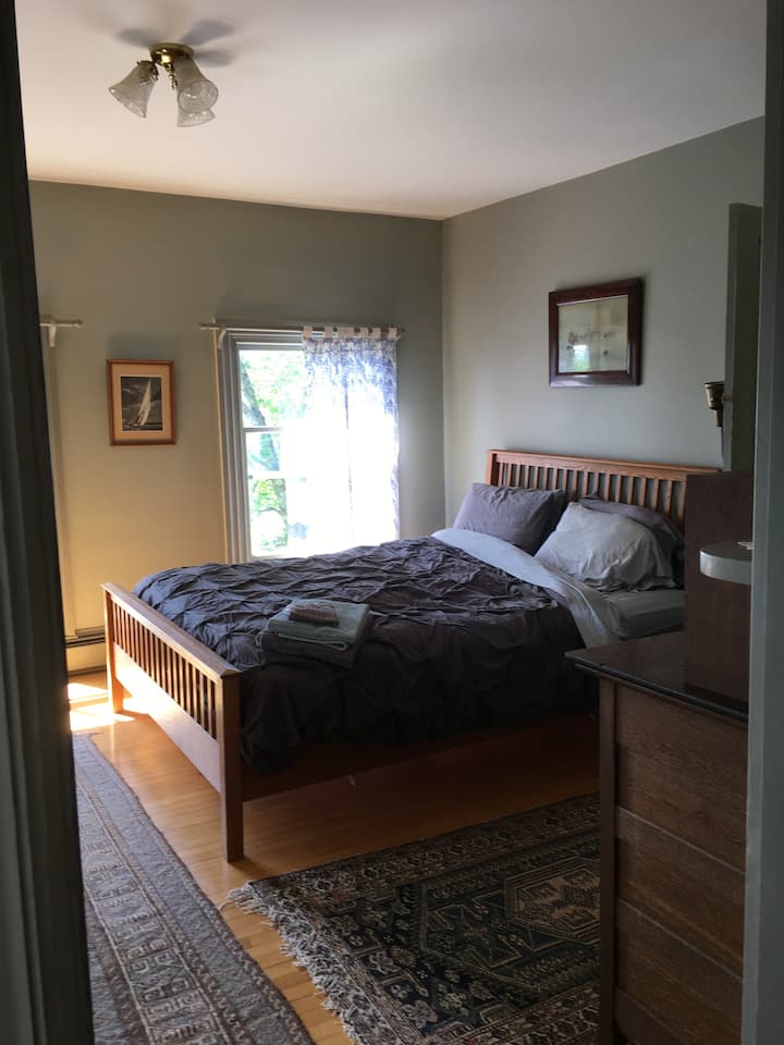 Master Bedroom - queen bed, desk, two dressers, and master bath.