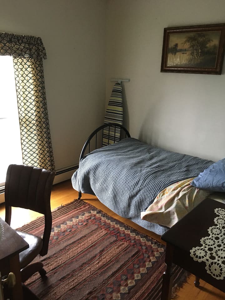 Twin bedroom - twin bed and desk.