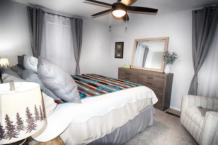 Primary bedroom with king bed and double closet