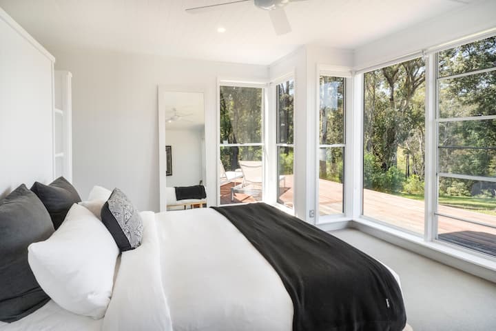 Main bedroom with ensuit and access to outdoor bathroom and sauna.