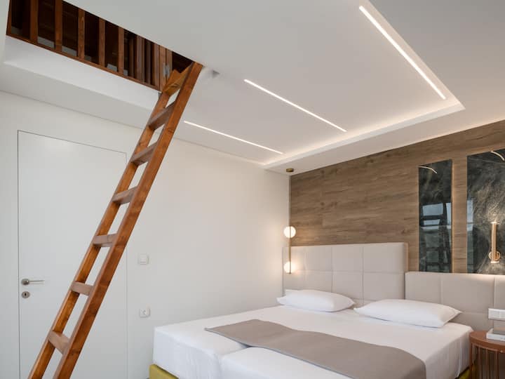 First floor bedroom with interior attic loft.