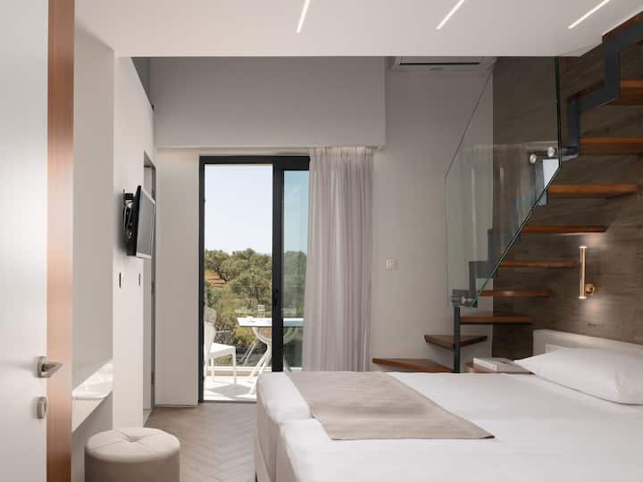 First floor bedroom with interior attic loft offering 3 single beds and 28’’ smart TV.