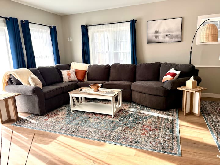 Enjoy a game night or a funny movie while relaxing on a comfortable sectional! We have another sofa on the opposite end of the living room. Both are hideaway couches that can accommodate four additional guests. Bedding is in the bathroom in a basket