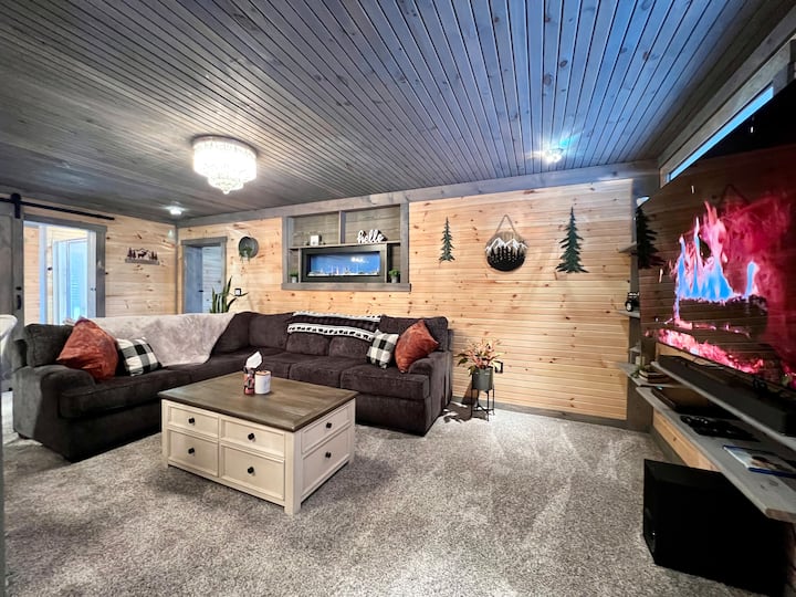 Cozy Living room with large sectional & dual-sided Fireplace