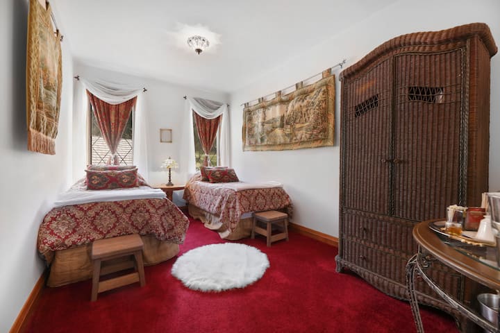 Twin Suite- THE most comfortable twin size beds (can be pushed together for a king), armoire with drawers, tapestries, tea service, and spa robes. The castle is more fun if you share it with a friend!