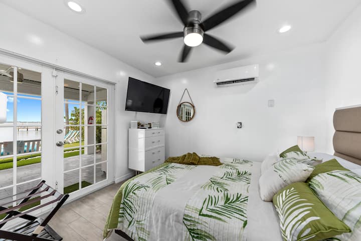 Riverfront queen bedroom on the home's lower (ground) level