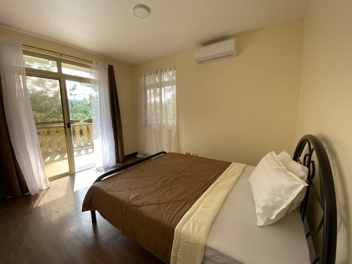 Master's bedroom with aircon and balcony
With attached bathroom