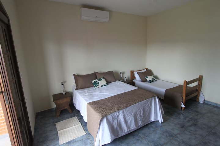 Bedroom 2 - double bed and 1 single bed with air conditioning, bedside table with reading lamps