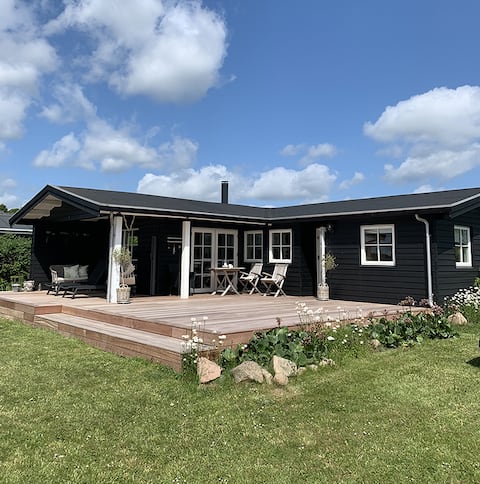 Charming log house by Følle beach