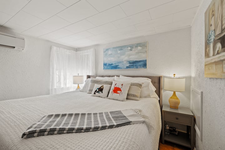 First Floor King Bed Room with mini split (AC & Heat). USB lights for easy phone charging on both bedside tables. Pottery barn organic sheets.