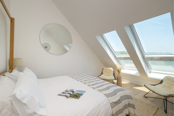 Master bedroom with super king size bed & stunning bay views.