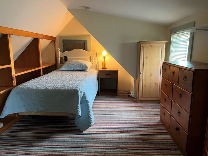 The "Hobbit Hole" nestled inside an upstairs gable.