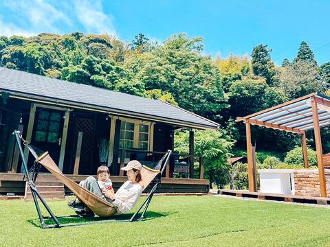 Overlooking the forest right in front of the house [a cute log house run by a teddy bear author]