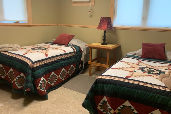 Downstairs bedroom with two twin mattresses 