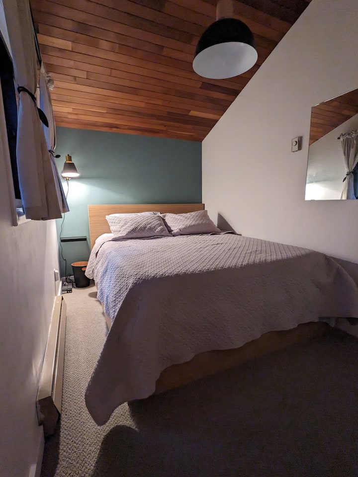 A cozy guest bedroom with under-bed storage