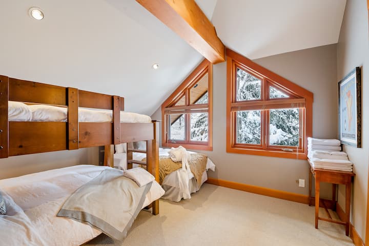 Bedroom 3-  has a single bed and a bunk bed with a twin bed on top and a queen below. Ensuite bathroom with a shower and bathtub.