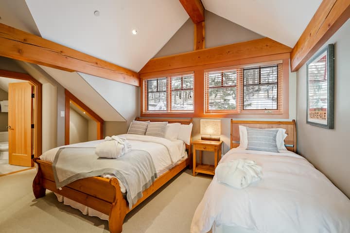 Bedroom 2- The room includes one queen and one twin bed with an ensuite shower. This floor is located one level below the upper. This room is accessed through the den room and next to bedroom 3.