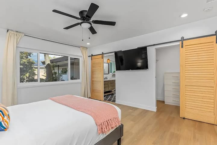 Comfy master bedroom with large Roku TV!