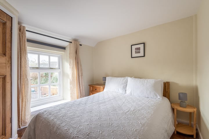 The third bedroom is a cosy double, overlooking the back garden. It has a built-in cupboard for storage.