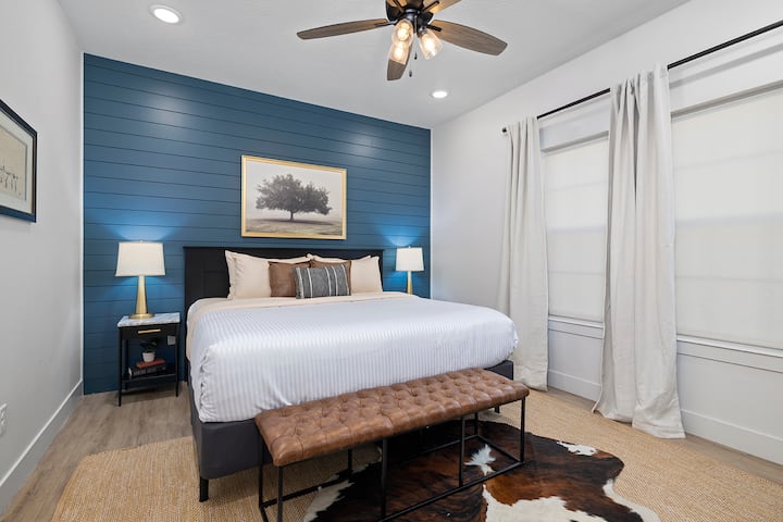 Main Floor Jr. Primary suite with King Bed and Ensuite Bathroom.