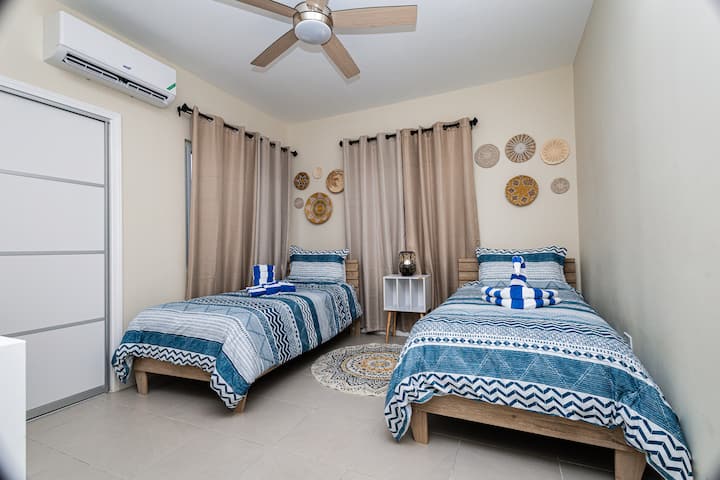 Second bedroom with twin beds at Ocean Escape Jamaica