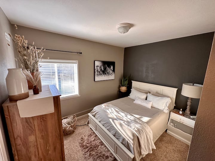 Bedroom with Queen bed and attached bathroom.