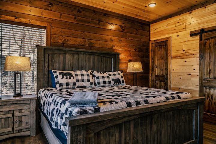 Main level master with en suite, memory foam mattress, and 55 inch smart TV.