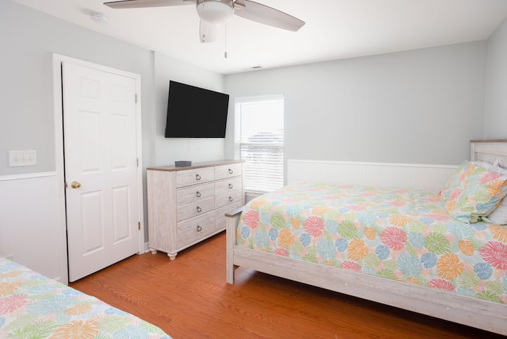 Second floor bedroom with a queen and a full size bed. This room also has a private bathroom.