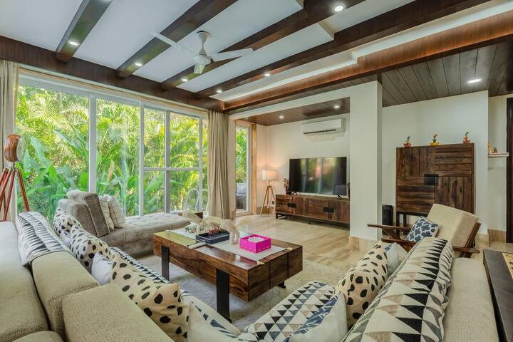 ✨When the indoors look this good, you won’t even miss the beach✨  
Lounge in luxury, binge your favourites, or just soak in the greenery from your couch — this is villa living done right.✨