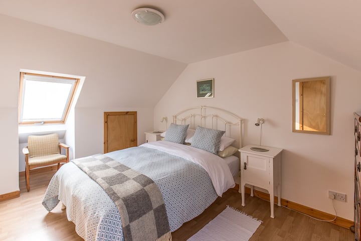 main upstairs bedroom with  king size bed with Good cupboard and hanging space for clothes, and large chest of drawers