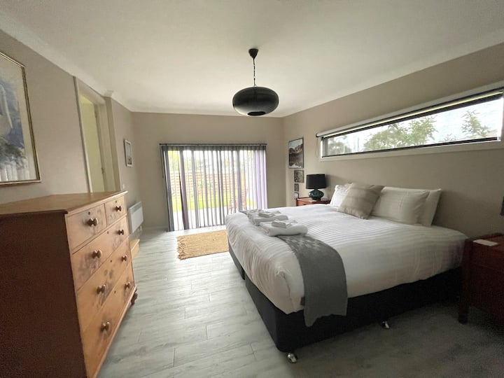 Master bedroom , luxurious King size bed in large sunny room with sliding door to garden.With its own on suite, sofa bead and private study desk this area affords privacy from the rest of the house.