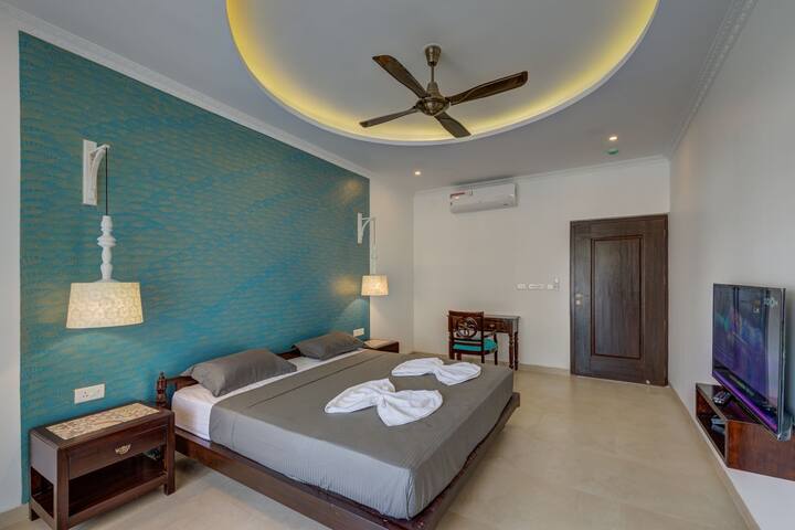 Luxurious and spacious bedroom with TV