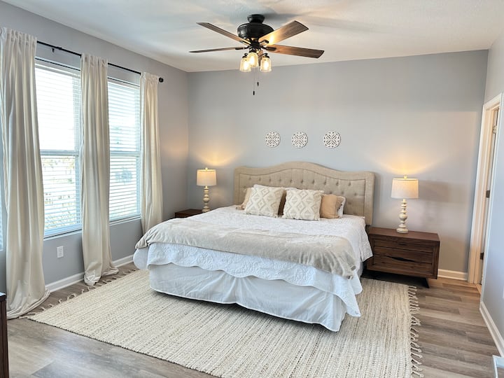 Mater bedroom with king bed. Decor is new, clean & serene!