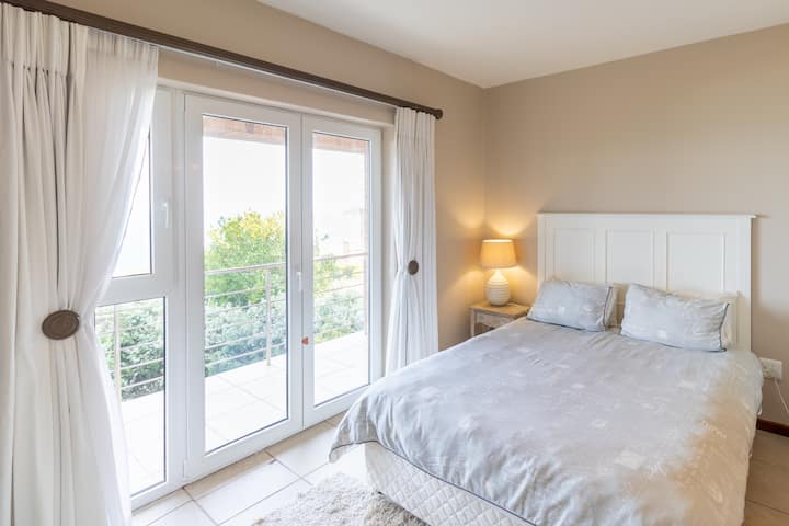 Queen bed with heated blankets on the second level 
Sea views and patio