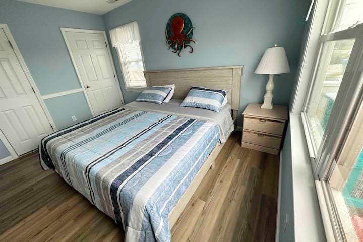 2nd bedroom with a king bed, smart tv, ceiling fan, and jack and jill bathroom