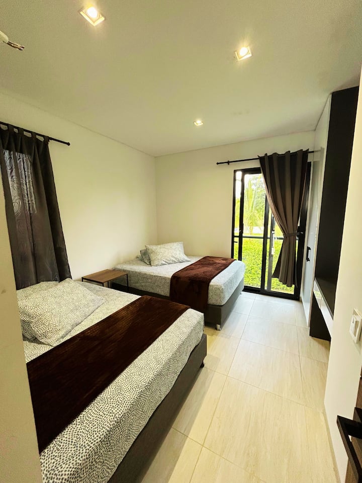 2nd Floor: Bedroom D

2 Queen beds, dedicated workspace and closet