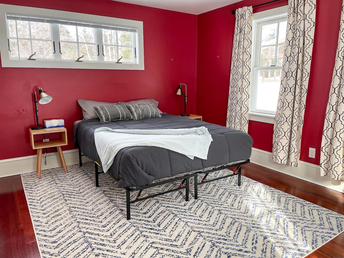 This is the only bedroom that is located on the first floor of the home. It is a queen bedroom, and it has its own private exit to the backyard.