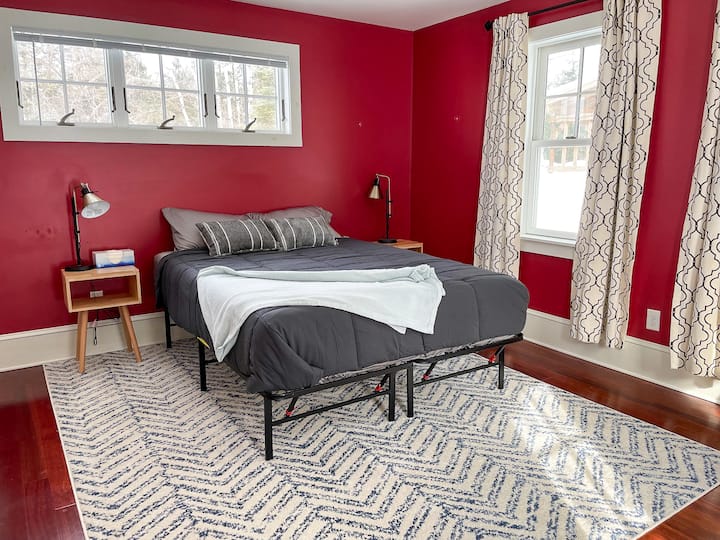 This is the only bedroom that is located on the first floor of the home. It is a queen bedroom, and it has its own private exit to the backyard.