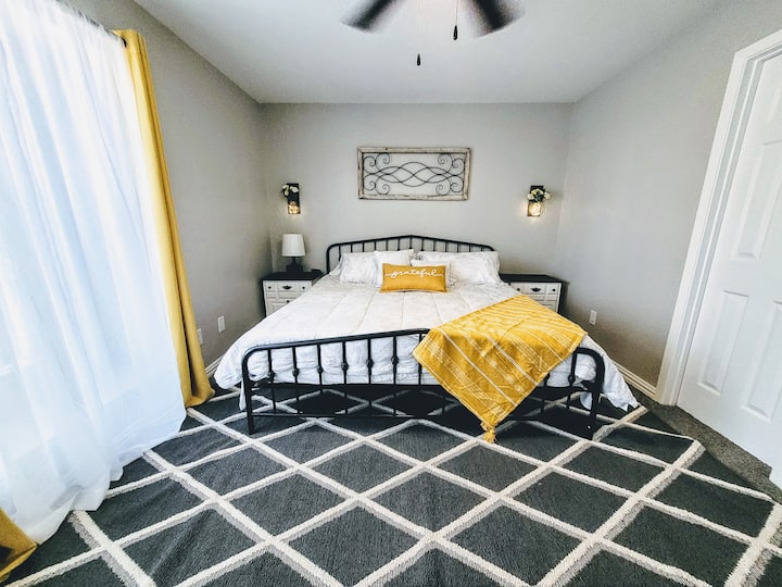 First bedroom featuring a king-sized bed.