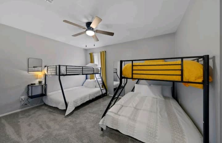 The bunk bed room with two twin over full beds, accommodating up to six guests.