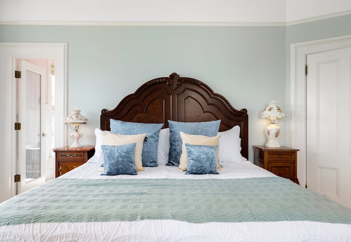 Water and Mt Baker view bedroom. King Bed, desk, fireplace.